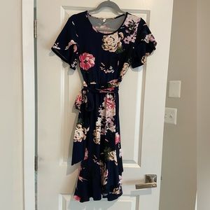 Pinkblush Maternity dress. Navy floral w/ waist tie and ruffle accent.